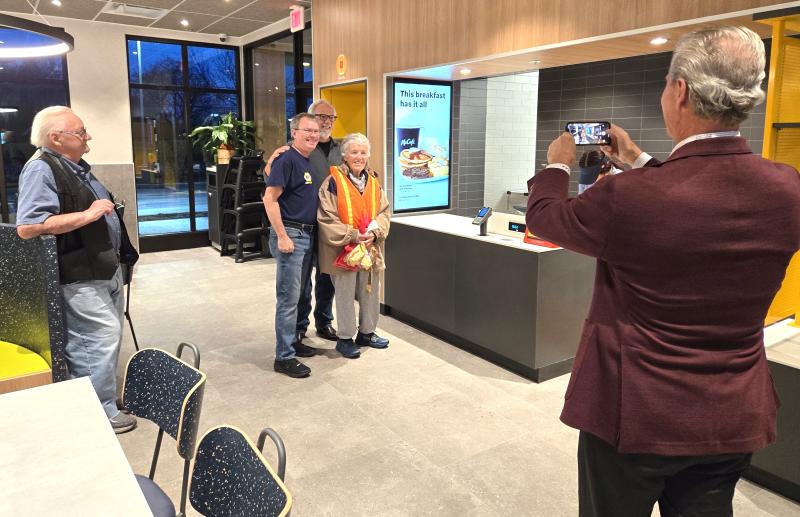 McDonald’s in Milton opened Dec. 11. Owner/operator Mike Meoli takes a picture of the restaurant’s first three customers (l-r) Chris Lovenguth, Frank Goehringer and Catherine Scott. CHRIS FLOOD PHOTOS